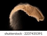 Small photo of Small size fine Sand flying explosion, Golden grain wave explode. Abstract cloud fly. Yellow colored sand splash silica in Air. Black background Isolated high speed shutter, throwing freeze shot