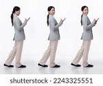 Small photo of Full Length 20s Asian Woman wear formal business blazer suit dress pant shoes. Black long straight hair female hold tablet work confident, walking forward turn left right, white background isolated