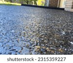 Wet Exposed aggregate concrete driveway path
