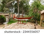 Small photo of Abu Dhabi, United Arab Emirates, March 19, 2023 : A model of an old Arab boat stands in the yard of the Heritable village Abu Dhabi museum in Abu Dhabi city, United Arab Emirates