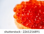 Small photo of Salmon Red caviar white background. Luxury delicacy food. Raw seafood. Macro fish caviar.