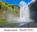 Skógafoss is a magnificent waterfall located in Iceland. It is known for its impressive height and the sheer power of its cascading waters. The waterfall is situated along the Skógá River, which flows