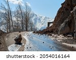 Small photo of Early spring in the mountains. The rocks fell on the road. Dangerous bugle road. Rockfall in the mountains.