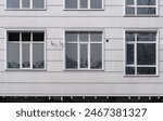 Several windows on the wall of...