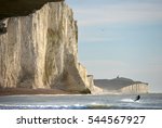 Jetsurfer in the sea at the base of the Chalk cliffs of the Seven Sisters