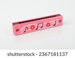 Small photo of Harmonica Mouth organ Wind instrument Blues harp Pocket-sized music maker Reeds and air chambers Melodious harmonics Portable musical instrument Diatonic harmonica Blues and folk music tool