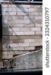 Small photo of block of concrete walls that make up a strong building, stacked crosswise