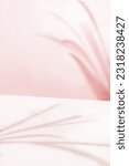 Small photo of Pastel Pink Tonal Background with Natural Leaf Shadows