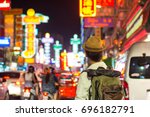 Young Asian traveler  in China town at night in Bangkok, Thailand