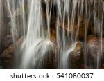 Small photo of waterfall. downflow of water on stones. water streams beautifully fall on stones