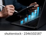 Small photo of stock trading ideas Businessman holding smartphone with stock chart showing various analytical data to make a purchase decision stock trading, wealth stock investing digital transformation technology