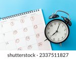 Calendar and clock with 3 days off on blue background.