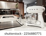 Small photo of Russia, Nizhny Novgorod - January 21 2022: Kitchen appliance Store. On a kitchen worktop close-up SMEG branded mixer, appliance for easy living, a popular Italian manufacturer