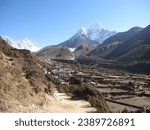 Small photo of Picturesque scenery encompassing a village, agricultural fields, evidence of erosive effects from the 1977 Glacial Lake Outburst Flood (GLOF), and the Ama Dablam (6814 m).