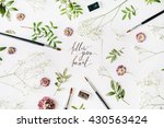 Flat lay composition, workspace with quote follow your heart written in calligraphy style on white paper. Artist working place