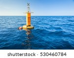 Yellow Sea Buoy In Blue Sea At...