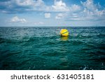 Yellow Sea Buoy In Blue Sea At...