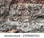 Textured Rock Wall with Architectural Background