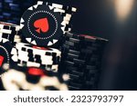 Tall Pile Of Black And White Casino Poker Chips With Red Spade Symbol. 