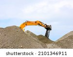 Heavy Machinery Digs Sand ...