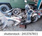 Small photo of Lamongan, Indonesia - January 17, 2024: white Honda Beat motorbike engine dismantling workshop The condition of the Honda Beat motorbike has been dismantled and ready to be serviced
