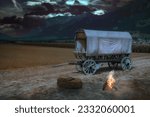 Covered wagon near Landquart in a thunderstorm atmosphere and campfire