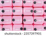 lot of Professional Liquid Wash Soap Refill light pink color chemicals in plastic bottles cans in the warehouse store. Heap Antibacterial Hand Soap in plastic canisters with white plastic cork cap.