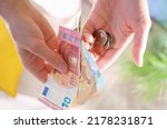 Small photo of Inflation and hyperinflation financial concept. Property tax and money leverage. falling salaries and purchasing power. poverty and famine. Social security concept. euro banknotes and euro coins.