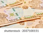 Small photo of Macro shot of uzbek sum banknote. Pile of Uzbek sums. Uzbek currency money bill. A stack of one hundred thousand Uzbek sum. 100000 sum