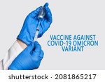 A Doctor Holds Vaccine Against...