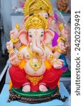 Small photo of Ganesh is the elephant-headed god who is the son of Shiva (the destroyer) and Parvathi (his consort), made from clay. Ganesh's body is representative of Maya, or the physical, while his elephant head