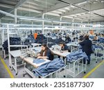 Small photo of istanbul, Istanbul Turkey - June 19, 2023: several sewing machines. Tailoring industry. jean making factory. jean sewing. worker working with sewing machines to sew jeans.