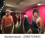 Small photo of Paris, France - 29 October 2023: Jacques Chirac Museum, Bollywood Superstars exhibition. Illuminated model of two Bollywood male movie stars.