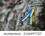 Yellow and blue ribbon (colors of Ukraine) attached to the chest of the Ukrainian Army (inscription in Ukrainian 