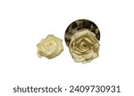 Small photo of icing roses, icing sugar flowers made from butter icing frosting isolated on white background