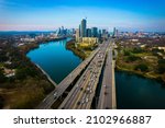 Small photo of Austin Texas USA a gorgeous capital City of Texas aerial drone views above Coloradp River and Interstate 35 and tall skyscrapers growing Cityscape
