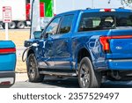 Small photo of Austin , Texas , USA - September 5th 2023: Electric Ford F150 Lightning charging at Electrify America Charging Station in Austin Texas