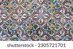 Small photo of Old traditional arista tiles found in Seville, floral motifs forming out of four tiles, spectacular designs with extensive historical and artistic value covering ceilings and walls in Andalusia, Spain