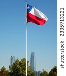 Small photo of Chilean flag in Bicentennial Park and business buildings, Santiago, Chile