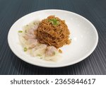 Small photo of stir fried dry soy sauce wanton noodle mee with pork chicken meat dumpling in plate on dark grey wood background asian snack dim sum halal food appetiser restaurant cuisine banquet menu for cafe