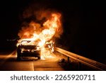 Small photo of Firefighters extinguish burning car on highway