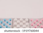 Small photo of a ablets of different colors in blisters on the background of medicines