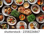 there are a lot of dishes on the wooden table. High quality photo