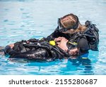 Scuba Diving rescue course surface skills checking for breathing of an unconscious diver