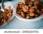 Small photo of A mouthwatering bowl of Chinese chicken and rice, showcasing deliciously seasoned poultry atop a bed of fluffy grains, ready to tantalize taste buds