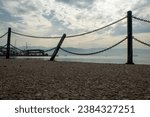 Small photo of seaside iron railings, chain railing, iron fence, abstract photo, broken iron railing, wonderful sky, red sky, orange sky, sunset