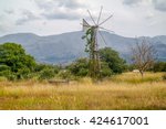 Old Rusty Windmill On The Field....