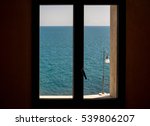 Closed Window Against Blue Sea
