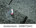 Small photo of Cigarette stubs on the rough floor. Selective focus with negative space. Warning: smoking addiction and health risk.