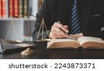 Small photo of Lawyers read legal books defend their clients' cases, the lawyer concept assumes that the defendant defends the client in order to win the case or gain the greatest benefit in accordance with the law.